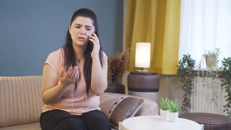 The-woman-arguing-with-her-husband-on-the-phone-takes-off-her-ring.